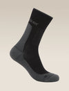 Black and gray sock on a beige background - Icebreaker Merino Hike+ Medium Crew Socks (Men's) - Black/Obsidian
