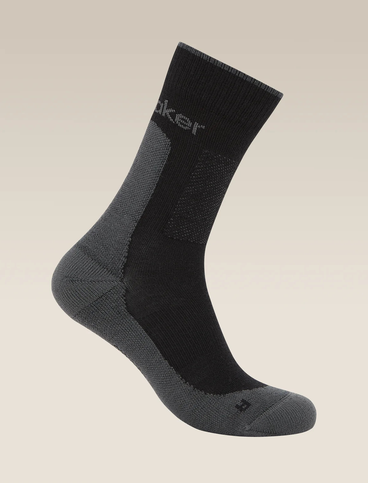 Black and gray sock on a beige background - Icebreaker Merino Hike+ Medium Crew Socks (Men's) - Black/Obsidian