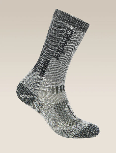 Gray sock with brand logo on a beige background - Icebreaker Merino Hike+ Mountaineer Mid Calf Socks (Women's) - Jet Heather/Black