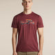 A man wearing a heathered maroon crewneck t-shirt with a graphic of a tow truck carrying a car, paired with khaki pants, against a solid beige background. - Icebreaker Merino 150 Tech Lite Short Sleeve T-Shirt Transportage (Men's) - Port
