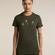 A woman modeling an olive green short-sleeve t-shirt with a graphic of four flying birds in light gray on the chest, set against a plain beige background. - Icebreaker Merino 150 Tech Lite Short Sleeve T-Shirt Bird Transit (Women's) - Dark Loden