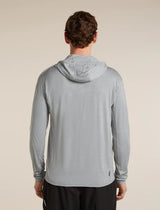 Man wearing a gray hooded jacket on a beige background - Icebreaker 150 MerinoFine Ace Long Sleeve Zip Hoodie (Men's) - Proto Grey