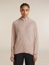 Person wearing a light pink zip-up jacket on a beige background - Icebreaker 150 MerinoFine Ace Long Sleeve Zip Hoodie (Women's) - Pink Quartz