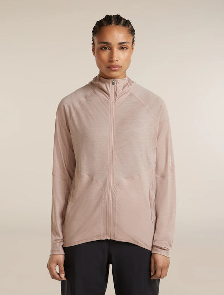 Person wearing a light pink zip-up jacket on a beige background - Icebreaker 150 MerinoFine Ace Long Sleeve Zip Hoodie (Women's) - Pink Quartz