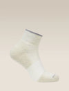 White sock with gray trim on a beige background - Icebreaker Merino Multisport Light Mini Socks (Men's) - Ecru Heather/Alloy/Snow