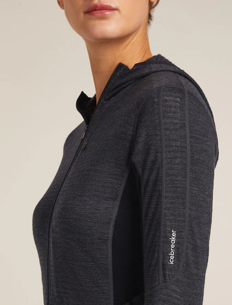 Dark gray zip-up hoodie with a visible brand logo on a beige background - Icebreaker Merino Blend 200 Realfleece Descender Long Sleeve Zip Hoodie (Women's) - Jet Heather/Black