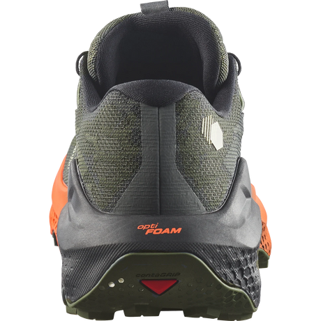 Close-up rear view of a trail running shoe in dark olive green and black with bright orange side accents, showing the heel, midsole, and outsole details. - Salomon Ultra Glide 4 Shoes (Men's) - Urban Chic/Black/Lime Cream