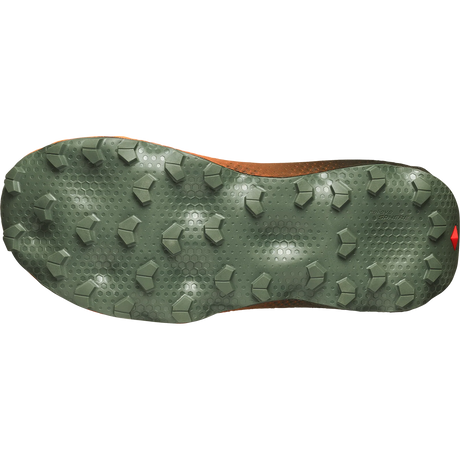 The outsole of a trail running shoe, featuring a dark olive green tread with hexagonal and pentagonal lugs, shown against a plain white background. - Salomon Ultra Glide 4 Shoes (Men's) - Urban Chic/Black/Lime Cream