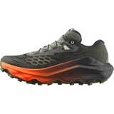 A trail running shoe shown in a side profile view against a solid white background. The shoe features a dark olive green and black mesh upper, a thick black midsole with a vibrant orange gradient transition, and a rugged black outsole. - Salomon Ultra Glide 4 Shoes (Men's) - Urban Chic/Black/Lime Cream