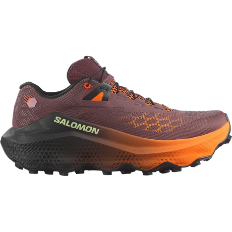 A Salomon trail running shoe in a dark plum-brown colorway with bright orange accents on the midsole, laces, and logo details, shown from a side profile on a white background. - Salomon Ultra Glide 4 Shoes (Women's) - Huckleberry/Black/Red Orange
