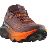 Salomon trail running shoe in a dark plum purple and bright orange colorway, featuring a textured knit upper, orange laces, and a thick orange and black midsole. - Salomon Ultra Glide 4 Shoes (Women's) - Huckleberry/Black/Red Orange