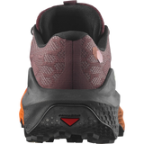 Close-up rear view of a trail running shoe showing the heel counter, textured burgundy mesh upper, black midsole, and bright orange outsole accents on a white background. - Salomon Ultra Glide 4 Shoes (Women's) - Huckleberry/Black/Red Orange