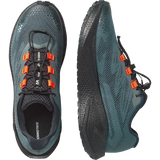 Salomon trail running shoes in a dark teal and black mesh, featuring bright orange laces and accents, shown from both top and side profile views on a white background.- Salomon Aero Blaze 4 GRVL Shoes (Men's) - Urban Chic/Black/Lime Cream