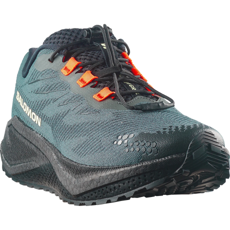 Salomon trail running shoe in dark teal and black with bright orange laces, shown from a three-quarters angle on a white background.- Salomon Aero Blaze 4 GRVL Shoes (Men's) - Urban Chic/Black/Lime Cream