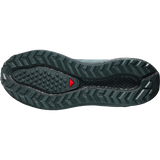 The outsole of a trail running shoe, showing a dark gray and black tread pattern with a small red triangular logo near the heel, on a solid white background.- Salomon Aero Blaze 4 GRVL Shoes (Men's) - Urban Chic/Black/Lime Cream