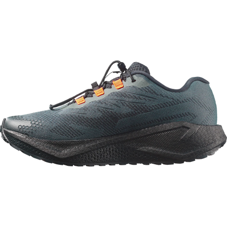 A dark slate blue-gray running shoe with a black midsole and outsole, featuring small orange accents on the laces, shown from a side profile view on a white background.- Salomon Aero Blaze 4 GRVL Shoes (Men's) - Urban Chic/Black/Lime Cream
