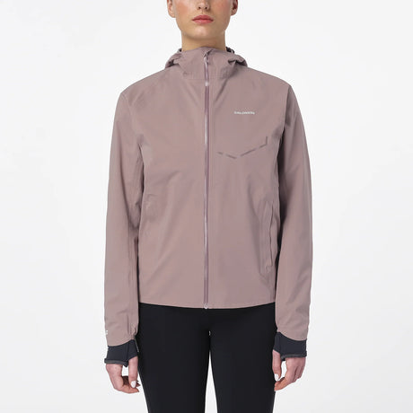 Person wearing a light brown jacket with a brand logo on a white background - Salomon Bonatti Waterproof Jacket (Women's) - Antler