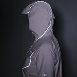 Gray raincoat with reflective accents on a black background - Salomon Bonatti Pro Jacket (Women's) - Icy Pink