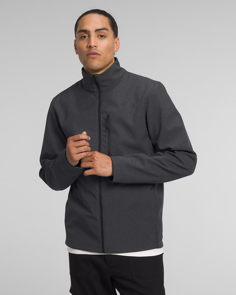 A man wearing a dark gray zip-up jacket with a stand-up collar, shown from the waist up against a light gray studio background. - The North Face Apex Bionic 3 Jacket (Men's) - TNF Dark Grey Heather