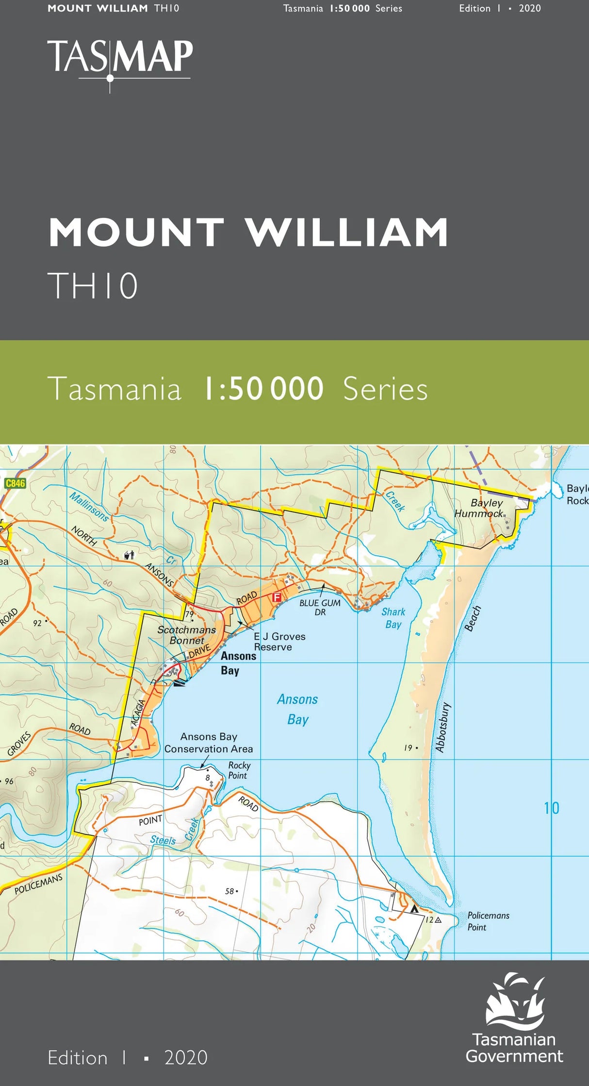 Front cover of a TASMAP Mount William TH10 map publication from Tasmania, showing a detailed coastal and inland map with roads, bays, and labels on a dark gray background with a green band. - Tasmap 1:50000 Topographic/Cadastral Maps - Mount William