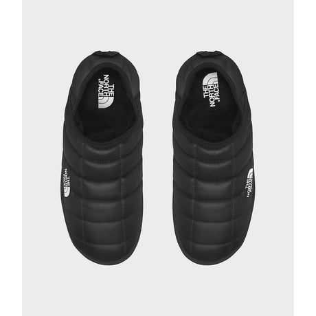 Black slip-on shoes with The North Face logo on a white background - The North Face ThermoBall Traction V Mules (Men's) - TNF Black/TNF White