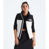 Person wearing a black and white North Face jacket on a white background - The North Face 1996 Retro Nuptse Vest (Womens) - White Dune/TNF Black-Recycled Down