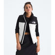 Person wearing a black and white North Face jacket on a white background - The North Face 1996 Retro Nuptse Vest (Womens) - White Dune/TNF Black-Recycled Down