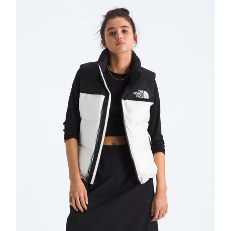 Person wearing a black and white North Face jacket on a white background - The North Face 1996 Retro Nuptse Vest (Womens) - White Dune/TNF Black-Recycled Down