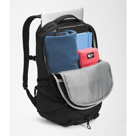 Black backpack with gray interior, containing a laptop, blue sweater, pink beanie, and other items on a white background. - The North Face Borealis Backpack - TNF Black/TNF Black-NPF