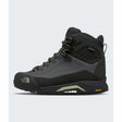 A high-top hiking boot by The North Face in black and dark gray, featuring a lace-up front, protective toe cap, and Vibram sole, shown against a light gray background. - The North Face Verto Alpine Mid GORE-TEX Boots (Women's) - Anthracite Grey/Lemon Mist