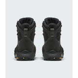 A pair of black high-top hiking boots shown from the back, featuring a matte finish with small gold accents on the pull tabs and outsole. - The North Face Verto Alpine Mid GORE-TEX Boots (Women's) - Anthracite Grey/Lemon Mist