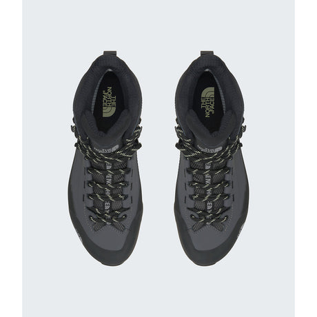 A pair of dark gray and black mid-cut hiking boots shown from a top-down view on a light gray background. The boots feature black laces with gray patterned detailing and the 'The North Face' logo is visible on the tongue. - The North Face Verto Alpine Mid GORE-TEX Boots (Women's) - Anthracite Grey/Lemon Mist