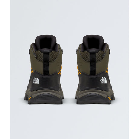 A pair of The North Face mid-height hiking boots shown from the back, featuring an olive green and black design with small yellow accents and white logo branding. - The North Face Hedgehog Mid GORE-TEX Boots (Men's) - New Taupe Green/TNF Black