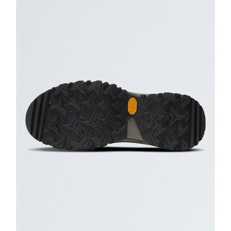 The bottom sole of a black Vibram hiking boot, showing a deep tread pattern and the signature yellow Vibram logo, set against a light gray background. - The North Face Hedgehog Mid GORE-TEX Boots (Women's) - TNF Black/Asphalt Grey