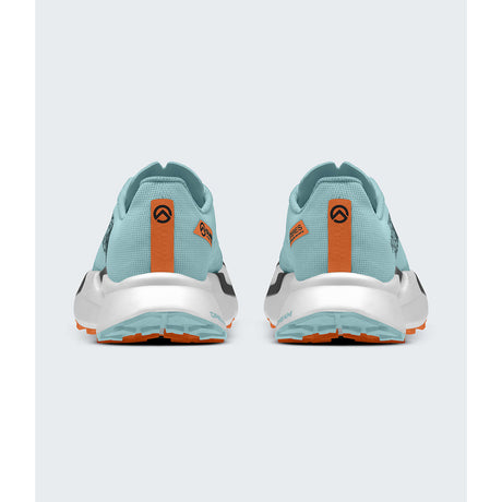 A pair of running shoes shown from the back, featuring a light blue-green mesh upper, a white midsole, and bright orange heel accents with black logo details, set against a light gray background. - The North Face Summit Series VECTIV Pro 3 Shoes (Unisex) - Canal Blue/Papaya