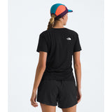 A woman shown from the back wearing a black short-sleeve athletic T-shirt with a small white The North Face logo on the upper back, black shorts, and a multicolor cap against a light gray studio background. - The North Face Sunriser Short-Sleeve T-Shirt (Women's) - TNF Black