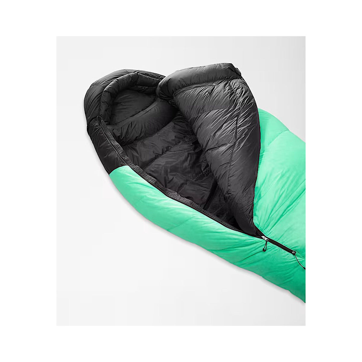 A mummy-style sleeping bag shown open on a light gray background, with a bright green outer shell and a black quilted interior. - The North Face Inferno Sleeping Bag - 0F / -18C