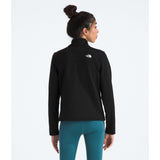 Person wearing a black jacket with a logo on the back, standing against a white background - The North Face Cedar Trail Grid Fleece Jacket (Women's) - TNF Black