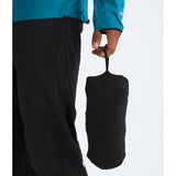 Person holding a black compression bag with a white background - The North Face Summit Series Off Width Jacket (Men's) - TNF Black