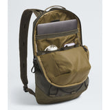 An olive green backpack shown open, revealing multiple compartments, mesh pockets, and padded shoulder straps, with a laptop and small accessories stored inside, on a light gray studio background. - The North Face Base Camp Voyager Pro Lightweight Pack - New Taupe Green/TNF Black
