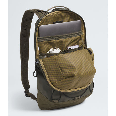 An olive green backpack shown open, revealing multiple compartments, mesh pockets, and padded shoulder straps, with a laptop and small accessories stored inside, on a light gray studio background. - The North Face Base Camp Voyager Pro Lightweight Pack - New Taupe Green/TNF Black