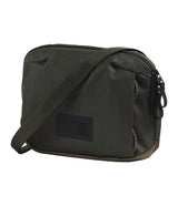 The North Face dark olive green nylon shoulder bag with a black brand patch on the front, set against a plain white background. - The North Face Base Camp Voyager Pro Crossbody Bag - New Taupe Green/TNF Black
