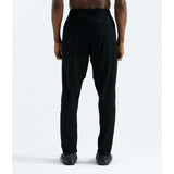 Black athletic pants with a drawstring waist, shown from the back on a model against a light gray studio background. - The North Face Summit FUTUREFLEECE Pants (Men's) - TNF Black