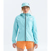 A woman modeling a light blue hooded jacket and matching bucket hat from The North Face, paired with orange shorts, against a plain white studio background. - The North Face Summit FUTURELIGHT Superior Jacket-Graphic (Women's) - Canal Blue