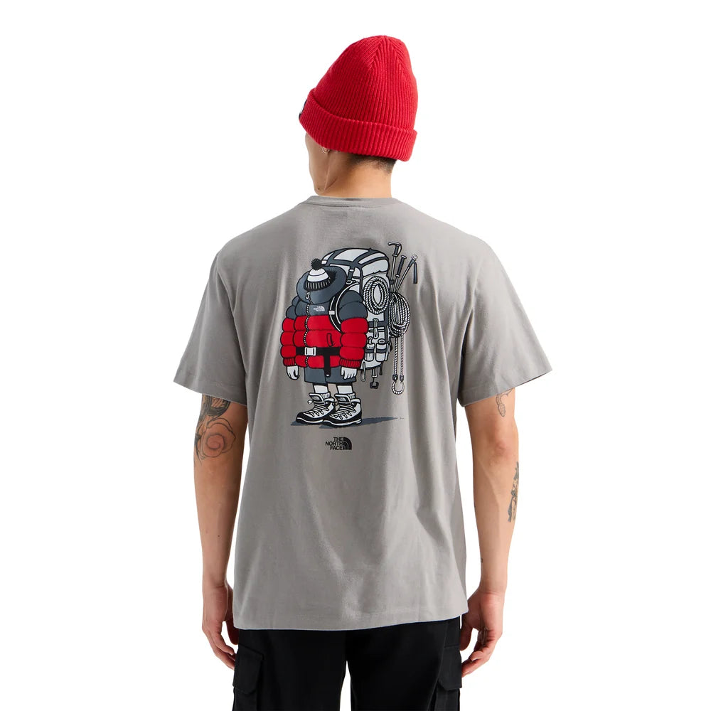Person wearing a gray t-shirt with a robot graphic on the back, standing against a white background. - The North Face Gear Up Get Out Relaxed Short-Sleeve Tee-Graphic (Unisex) - Stone Slab