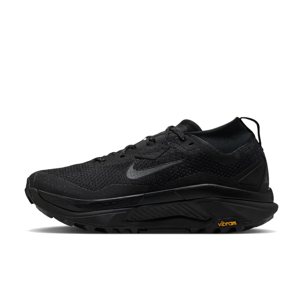 A black Nike running shoe with a textured mesh upper, a dark gray Swoosh logo, and a black Vibram outsole, shown in a side profile on a white background. - Nike ACG Zegama Trail GORE-TEX Shoes (Men's) - Black/Anthracite