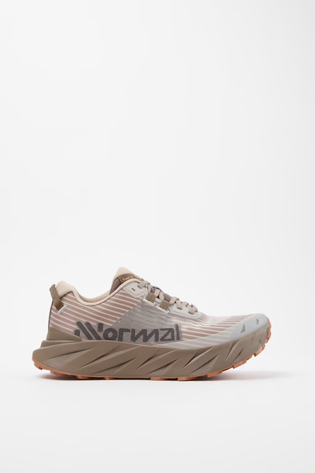 A single running shoe in a light beige and taupe colorway, featuring a textured knit upper, a thick sculpted midsole, and the 'Normal' brand name printed on the side, set against a plain white studio background. - NNormal Cadí Shoes (Men's) - Brown