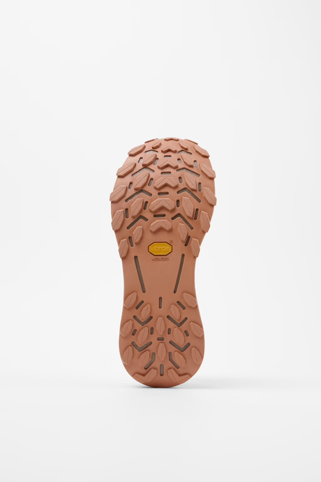 Close-up of a brown shoe sole with tread pattern on a white background - NNormal Cadí Shoes (Men's) - Brown