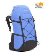 A blue and black hiking backpack with compression straps and external side pockets, shown on a white background with a 'Still Made in Australia' badge in the top right corner. - One Planet Extrovert 55 Pack - Blue