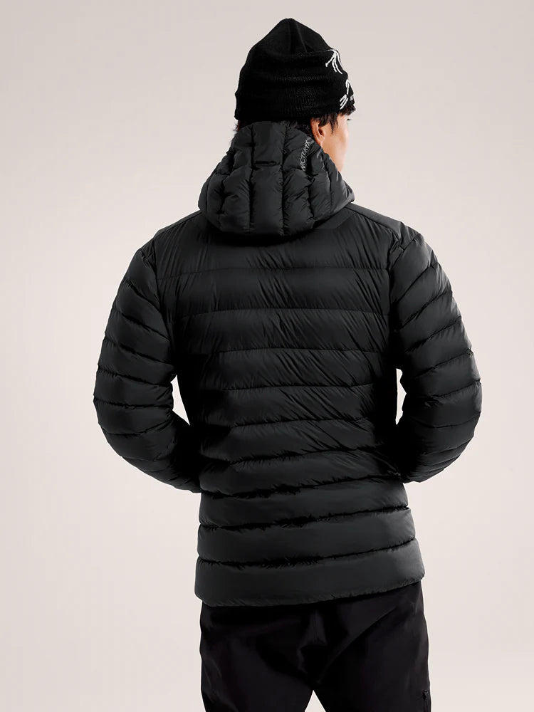 Person wearing a black puffer jacket and beanie on a light gray background - Arc'teryx Cerium Hoody (Men's) - Black